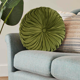 HIG Ripple olive round pillow outdoors in a covered space