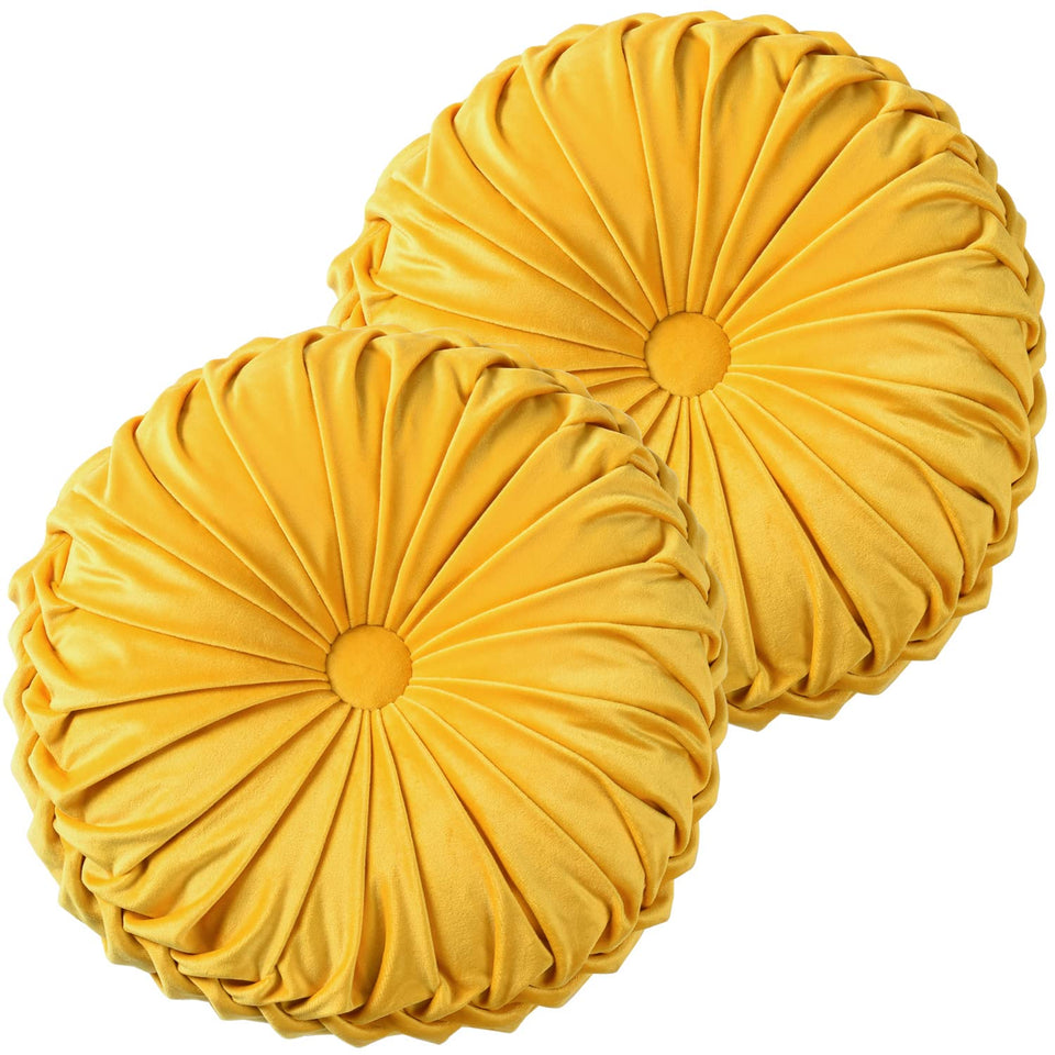 HIG yellow ruched velvet round pillow detail for luxe texture and style.