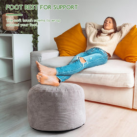 HIGOGOGO pouf foot rest beside sofa offers cozy comfort.