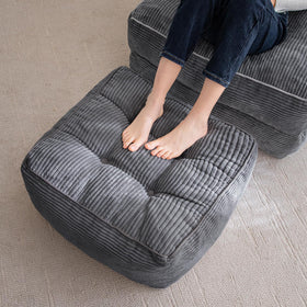 HIGOGOGO square pouf with foam chunk filling provides plush foot support.