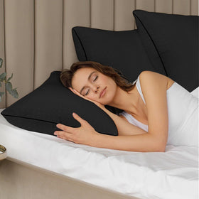 Higoom pillow with stylish black piping design for durability and style.