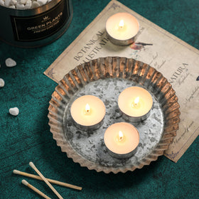 Hilumida unscented tea lights 200-pack in holder demonstrate easy table ambiance.
