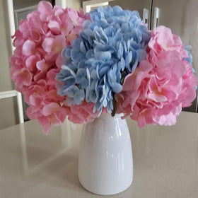 hjn autumn leaves displayed in the white vase for seasonal style.