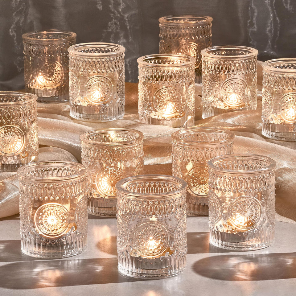 Hlukana clear glass votive holders for elegant centerpieces and ambient lighting.