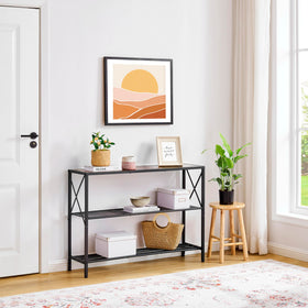 Hoctieon entryway setup showing console table in narrow space