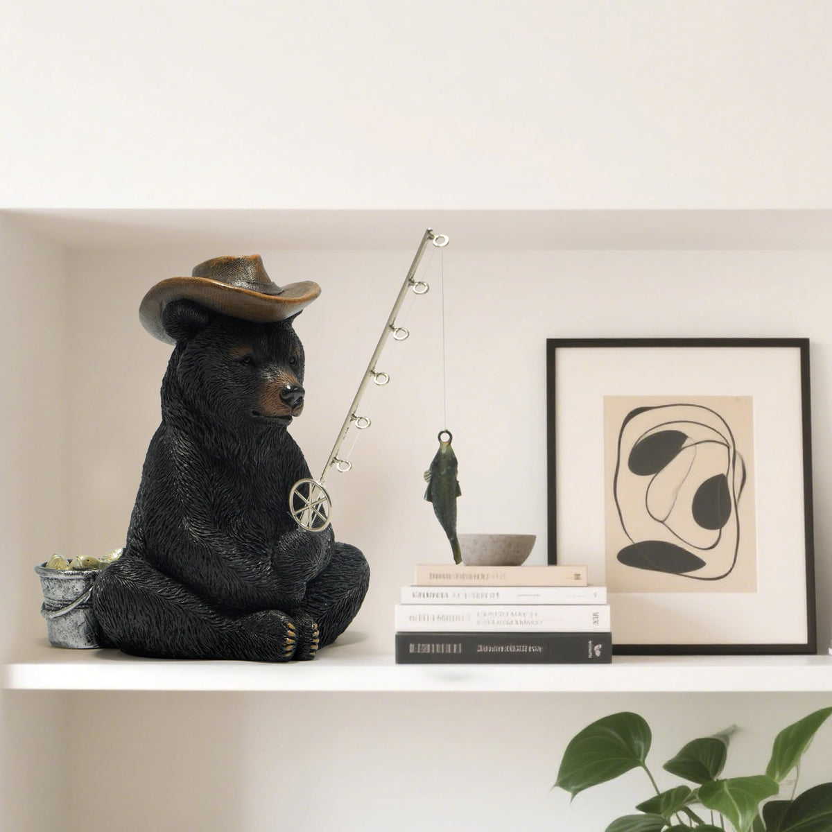 Hodao resin bear with metal fishing rod for durable tabletop display.