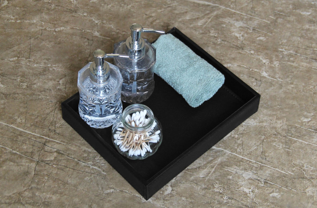 HofferRuffer cosmetics and jewelry arrangement on vanity tray for daily routine efficiency