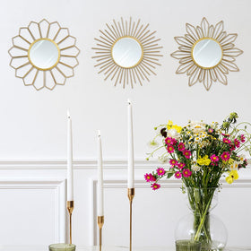 Hogardeck golden sunburst mirrors reflect light to create a warm ambience.