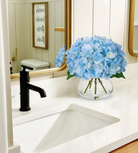 Hollyone glass vase with faux water enhances lifelike display.
