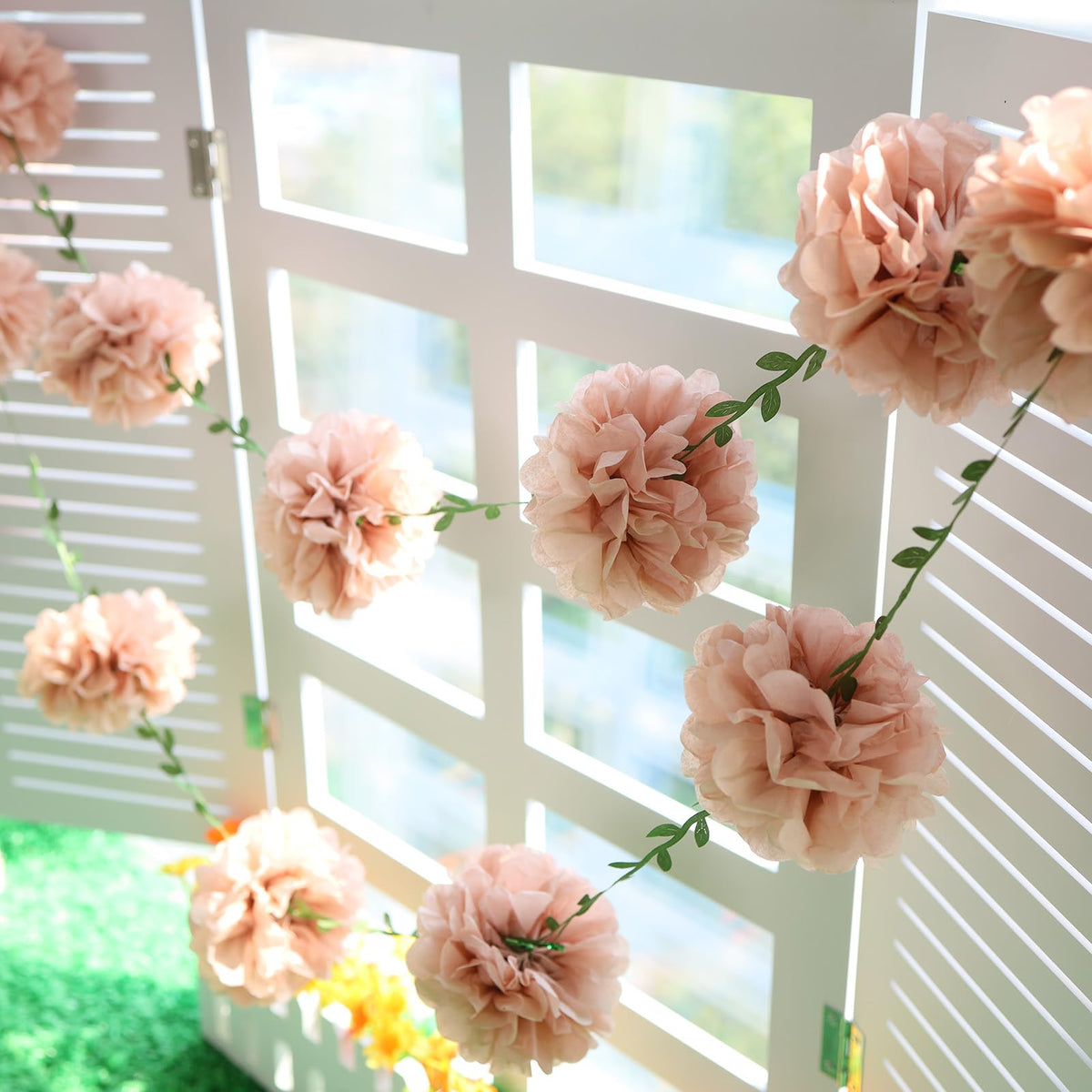 Homarkable pink tissue pom-pom garland is reusable and easy to store for future events