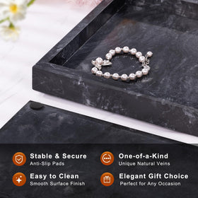 Homaura marble tray with distinctive veins highlights perfume or jewelry display.