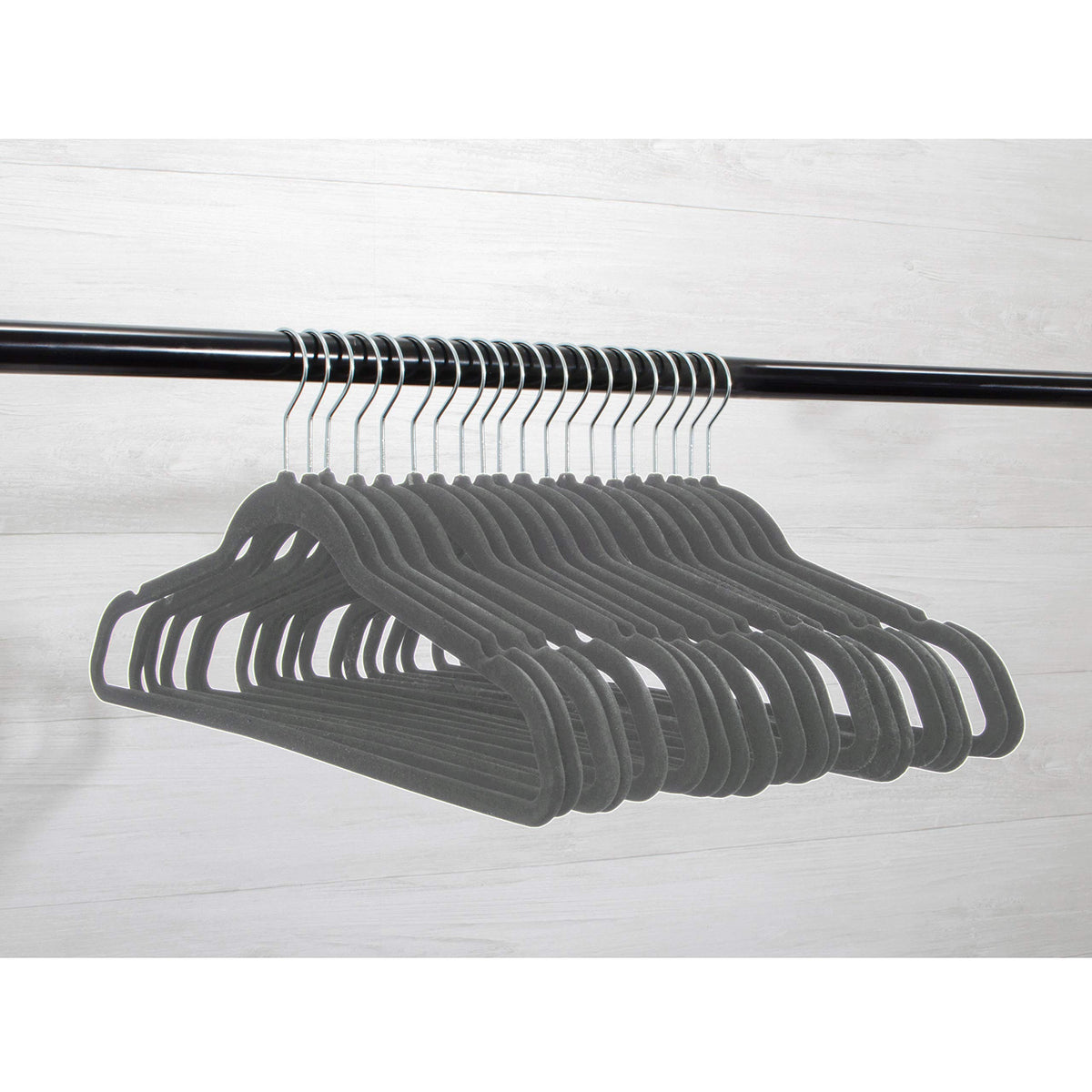 Velvet hanger showing notched shoulders for strap support by Home Expressions