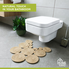 Home Turko Boho Jute Bath Mat water absorption demonstrates floor protection after showers.