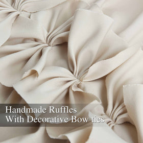 Homechoice Decor rod-pocket drapes in camel simplify hanging and maintain a neat look.