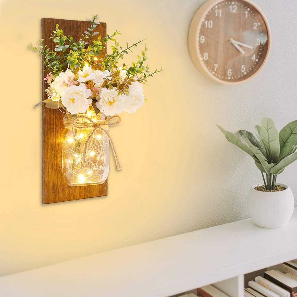 Homecor wall-hanging mason jar sconce with decorative twine and soft glow.