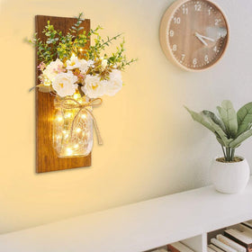 Homecor wall-hanging mason jar sconce with decorative twine and soft glow.