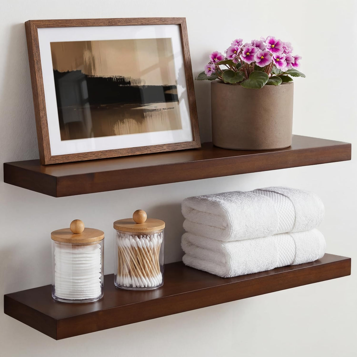 Homeforia 24in walnut floating shelves mounted on wall for elegant display.