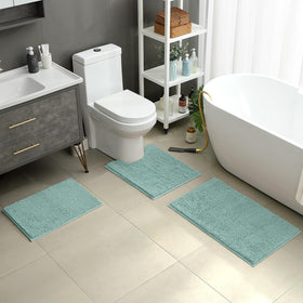 HOMEIDEAS eggshell blue U-shaped rug contours around the toilet for easy comfort.