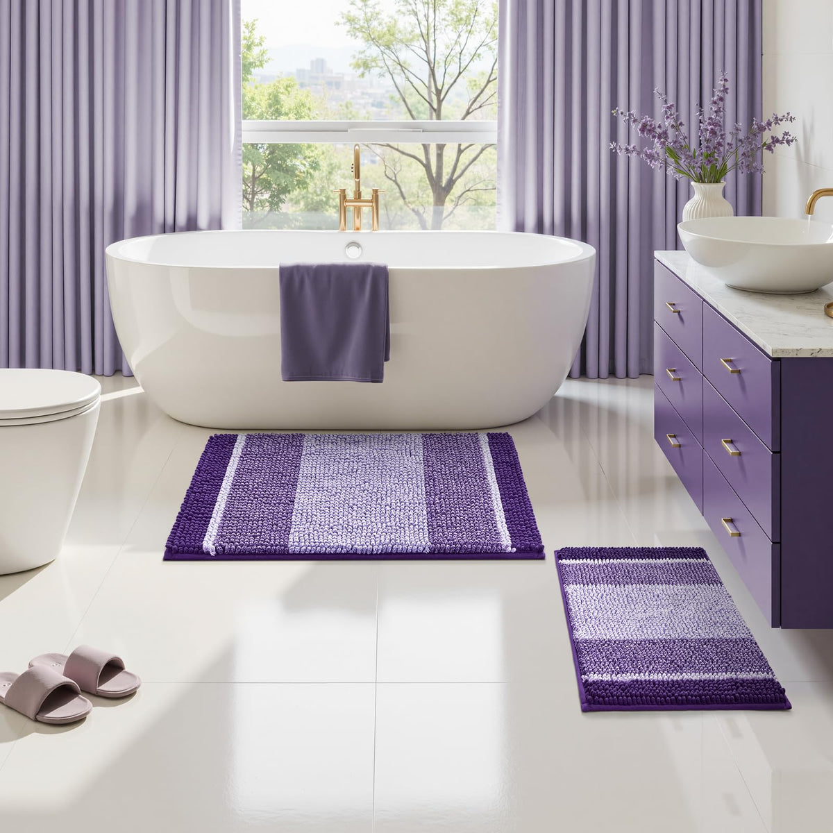HOMEIDEAS purple bathroom rugs set in bathroom by sink and tub area.