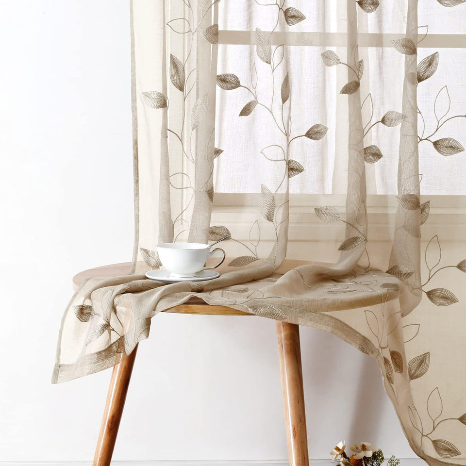 HOMEIDEAS taupe sheer curtains with embroidered leaves filtering soft light for bedrooms.