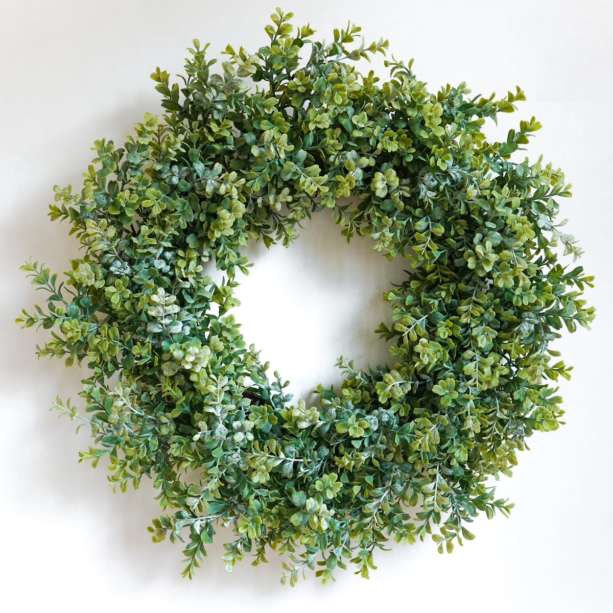 HomeKaren 24-inch front-door wreath with eucalyptus and boxwood leaves for welcoming entryways.