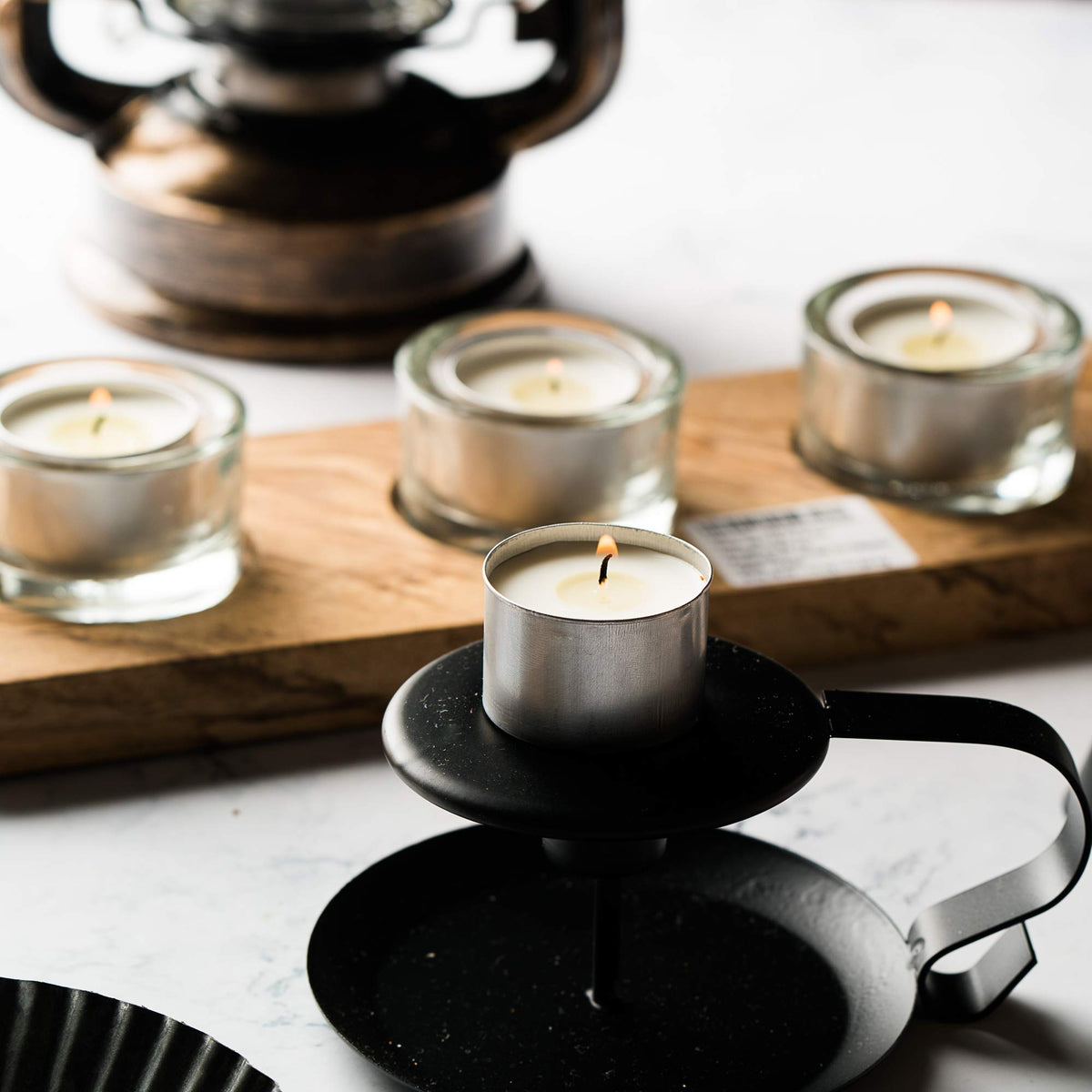 Home Lights Shabbat lighting with unscented tealights in a metal holder
