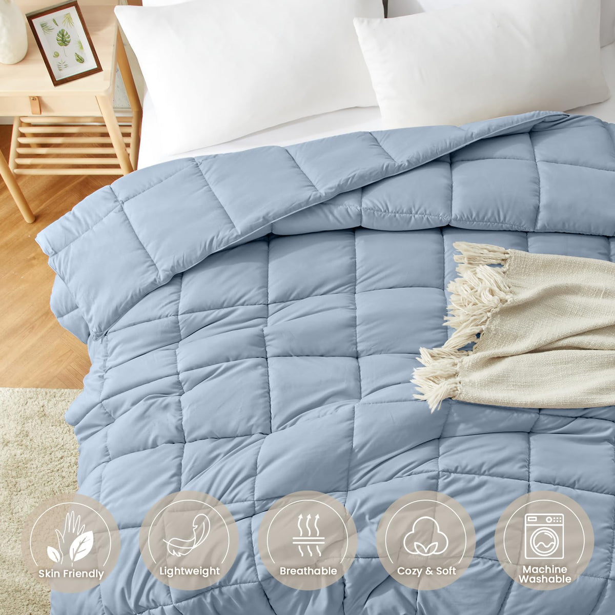 Homelike Moment Comforter blue in a cozy bedroom scene emphasizing all-season comfort.