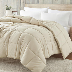 Homelike Moment Comforter folded in beige, lightweight year-round warmth.