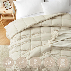 Homelike Moment Comforter on bed in beige for cozy nights.