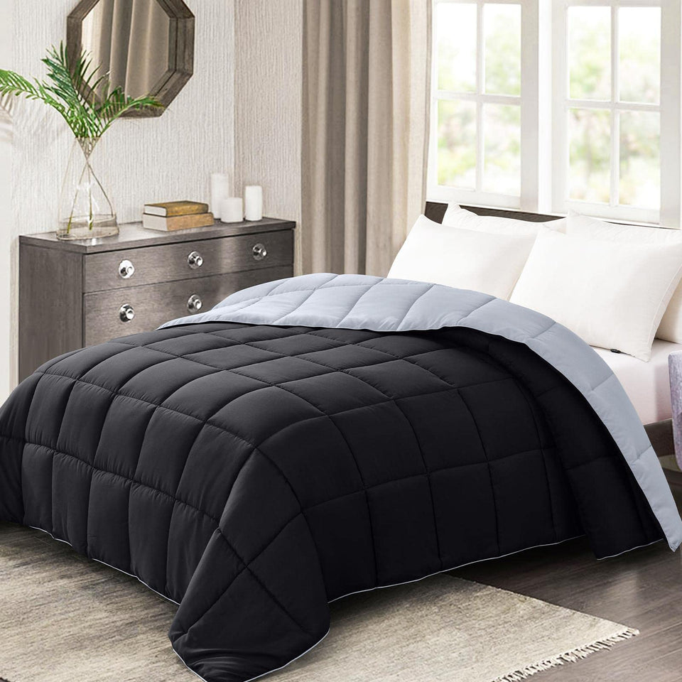 Homelike Moment comforter on bed with reversible black gray design for two looks.