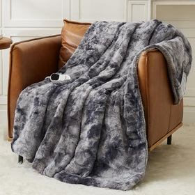 Homemate heated blanket with faux fur sherpa on bed for luxurious warmth.