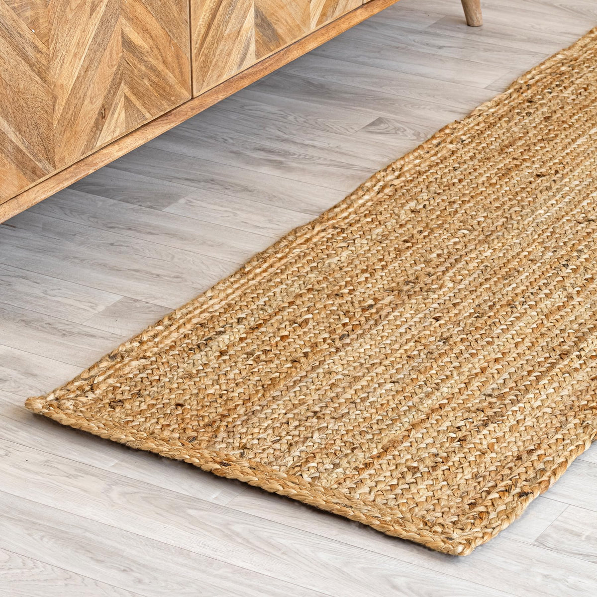 HOMEMONDE natural-color jute rug entryway adds rustic charm.