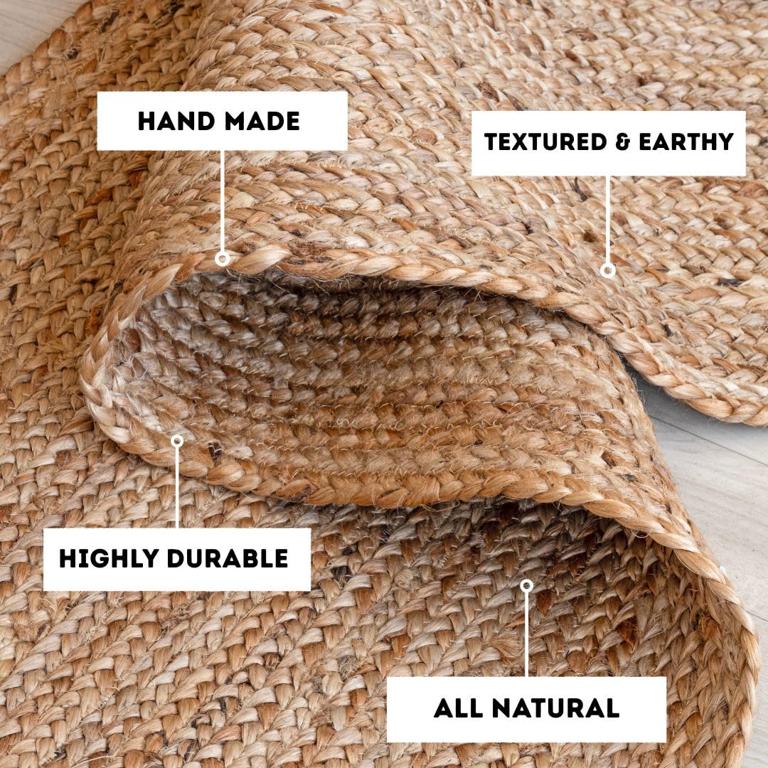 Homemonde round rug features reversible design and braided detail for styling versatility.
