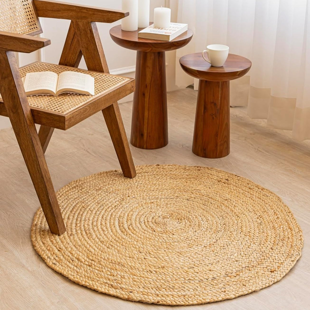 Homemonde three-foot round jute rug in natural color complements diverse decors.