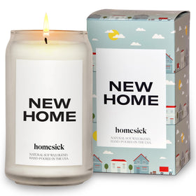 Homesick New Home candle jar glows warmly, perfect for welcoming a new space.