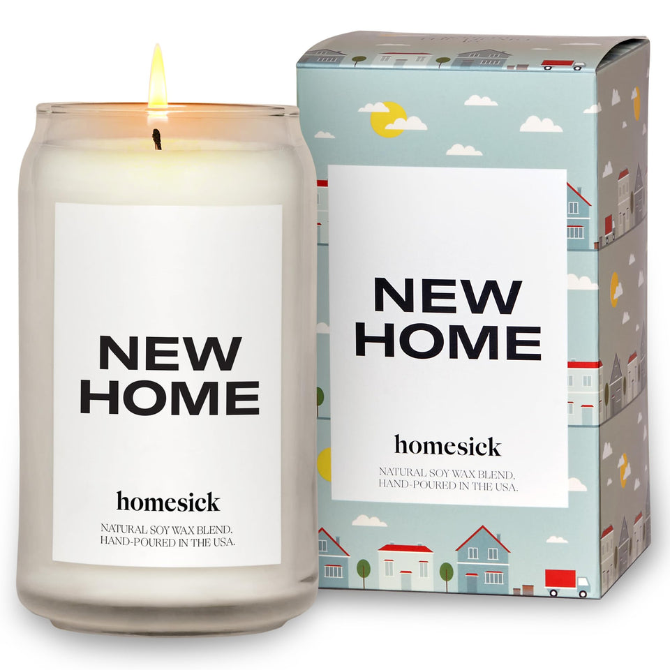 Homesick New Home candle jar glows warmly, perfect for welcoming a new space.