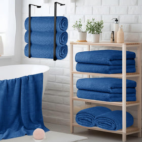 HOMEXCEL towel set in a clean hotel bathroom setting.