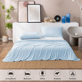 HOMFINE cooling blanket on a couch shows versatile use for relaxation and naps.