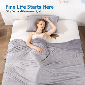 HOMFINE cooling blanket on couch during TV time for cool comfort.