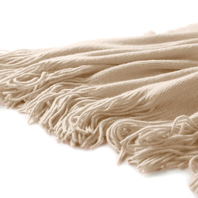 Homiest taupe blanket with fringe complements beds, sofas, and chairs.