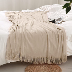 Homiest soft acrylic throw on a couch for cozy evenings.