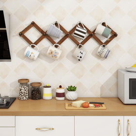 Homode peg rack holding hats, mugs, and scarves for organized spaces.