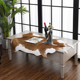 HOMORE cowhide rug in front of fireplace adds warmth and style