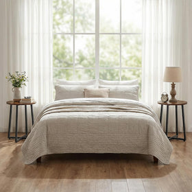 HOOBRO round side table used as a nightstand in a cozy bedroom.