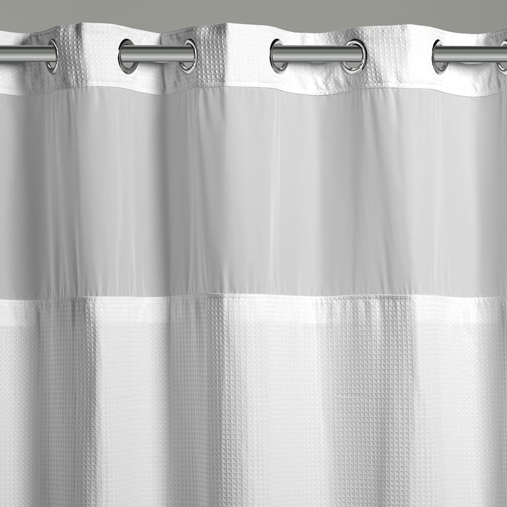 Hookless waffle fabric curtain adds a spa-like feel and quick water shedding.