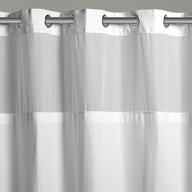 Hookless waffle fabric curtain adds a spa-like feel and quick water shedding.