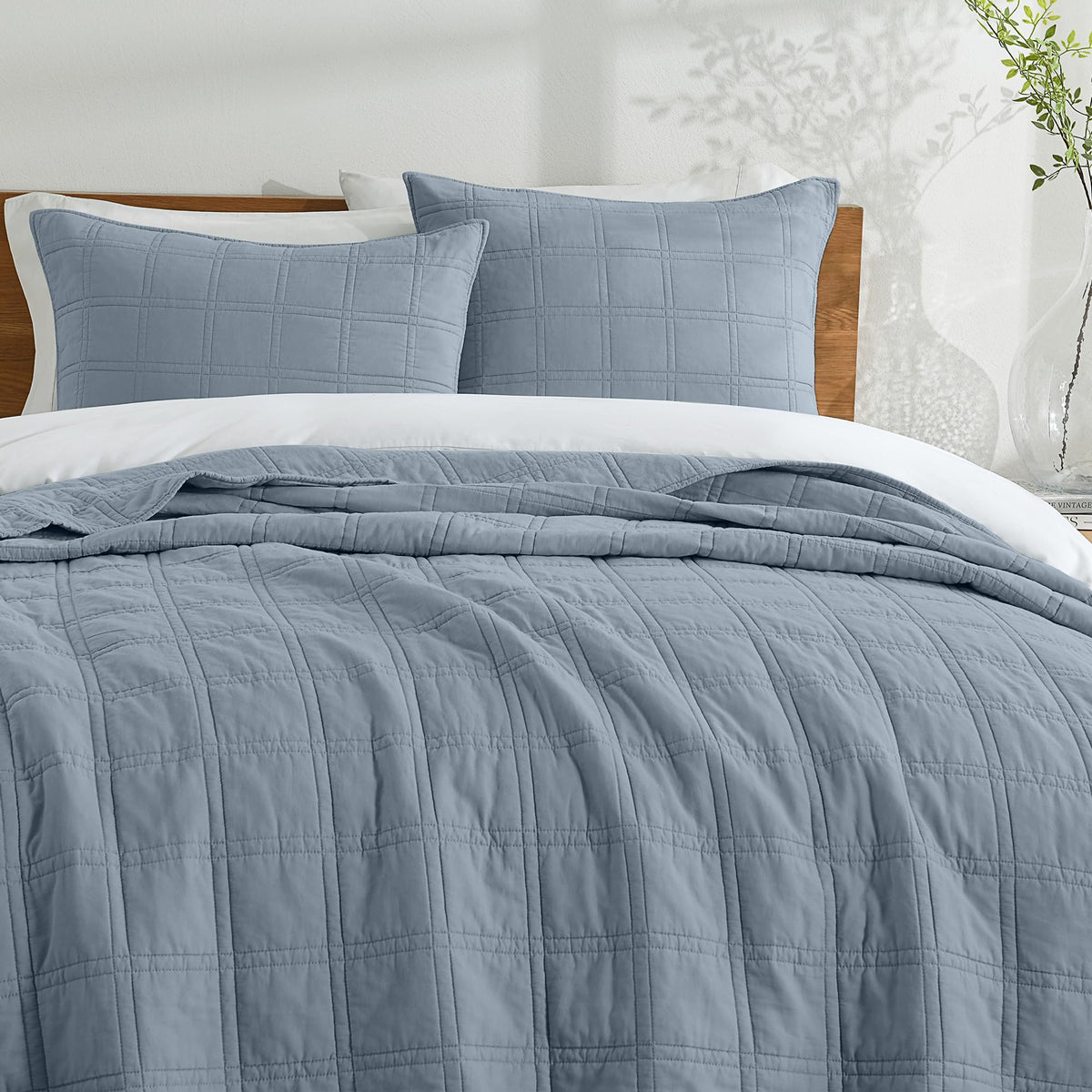 HORIMOTE HOME Adriatic Blue stitch detail echoes refined bedding decor.