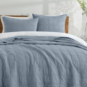 HORIMOTE HOME Adriatic Blue stitch detail echoes refined bedding decor.