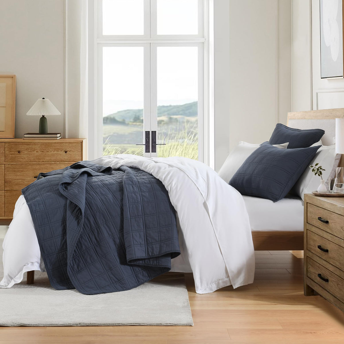 HORIMOTE HOME denim blue quilt folded close-up highlights softness.