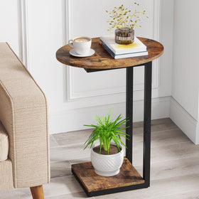 Hosfais side table with oval wood top and metal frame beside the sofa for convenient surface.